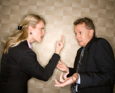 Businesswoman Flipping off Businessman